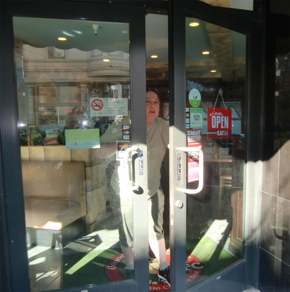 Photo of a woman coming out a store